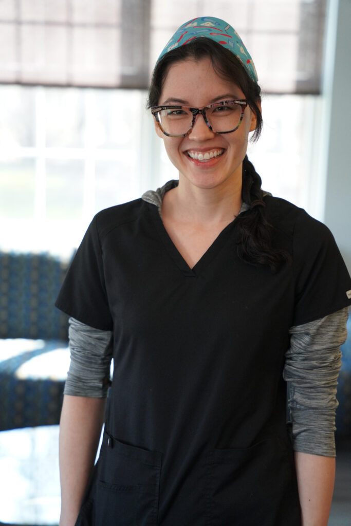 Portrait of Kiki standing in The Buffalo Dentist's lobby