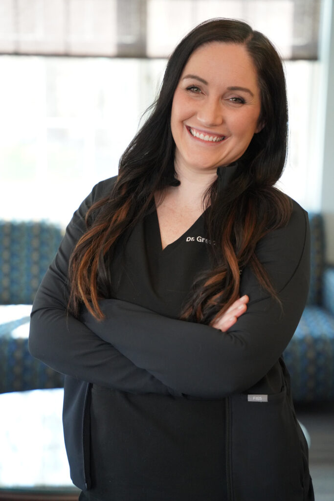 Dr Gretchen Galvin posing in The Buffalo Dentist waiting room